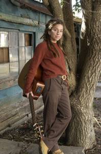 Musician Ani DiFranco stands outside her home in New Orleans Dec. 30, 2003. DiFranco, 33, produced her latest album, "Educated Guess," on her own as well as playing all the instruments herself. (AP Photo/Bill Haber)